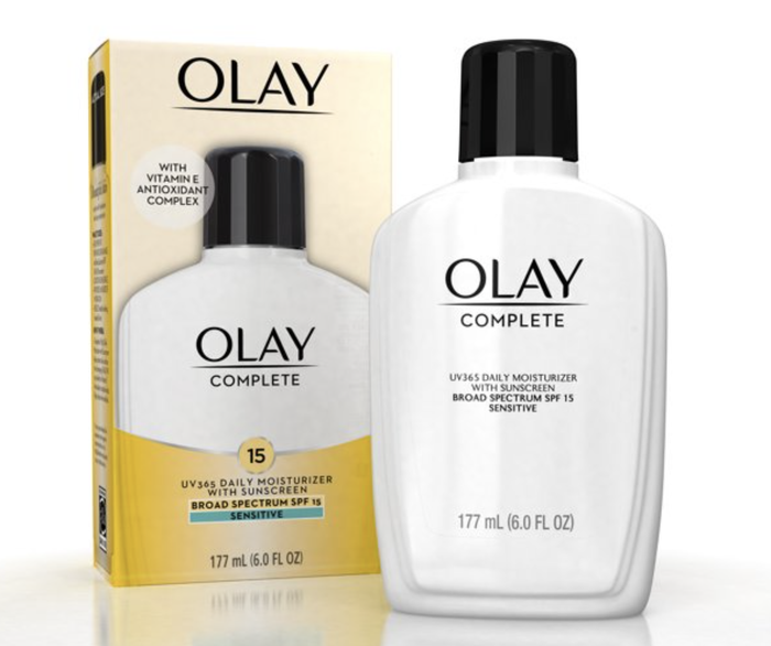 The moisturizer bottle placed next to its packaging box