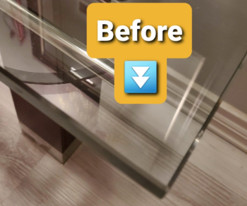 A detailed close-up of the sharp edge on a glass coffee table, highlighting potential safety concerns
