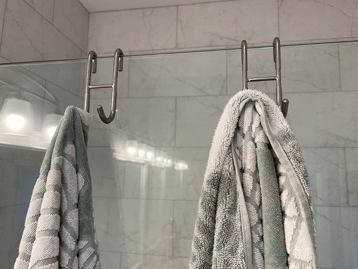Reviewer image of two silver hooks holding towels