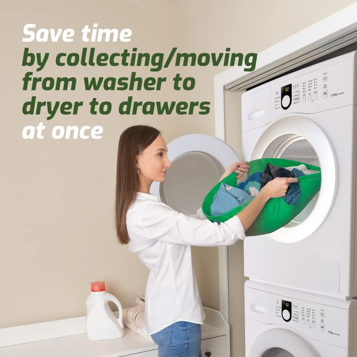 A model effortlessly removing laundry from the dryer using the green carrier