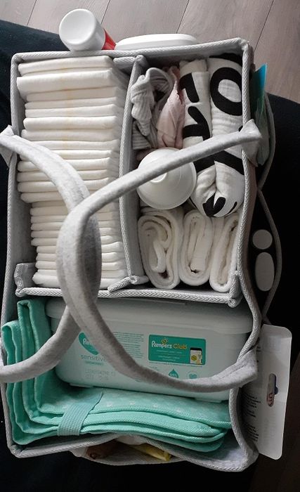 An organizer stocked with baby essentials like diapers, wipes, and clothes for efficient and tidy storage