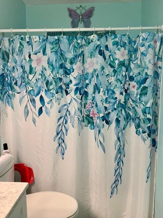 Reviewer image of a floral-patterned shower curtain
