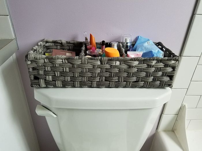 Image of a basket placed on a toilet