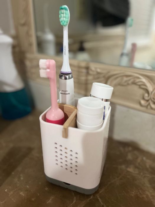 Review image of the white and grey toothbrush holder