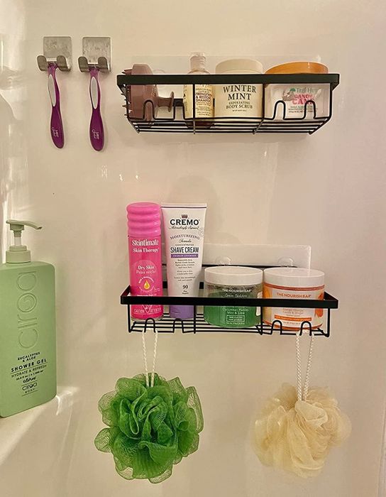 A reviewer image showcasing the shower shelves in use.