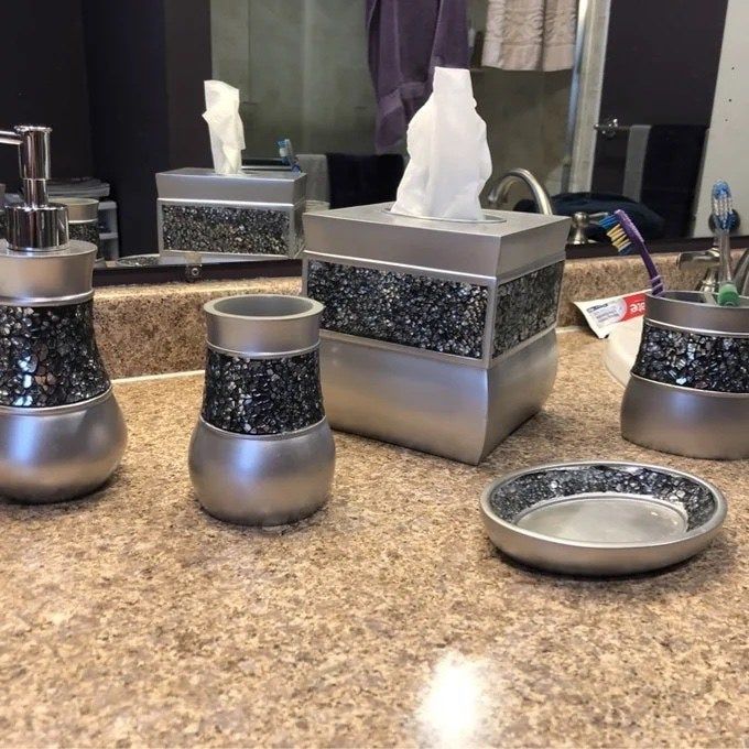 A close-up view of the same bathroom accessory set.