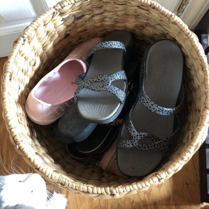 The woven cat storage basket, now with shoes inside.
