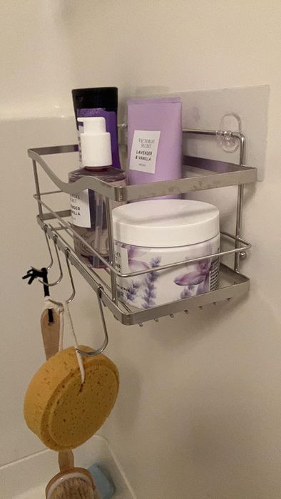 A silver shower shelf