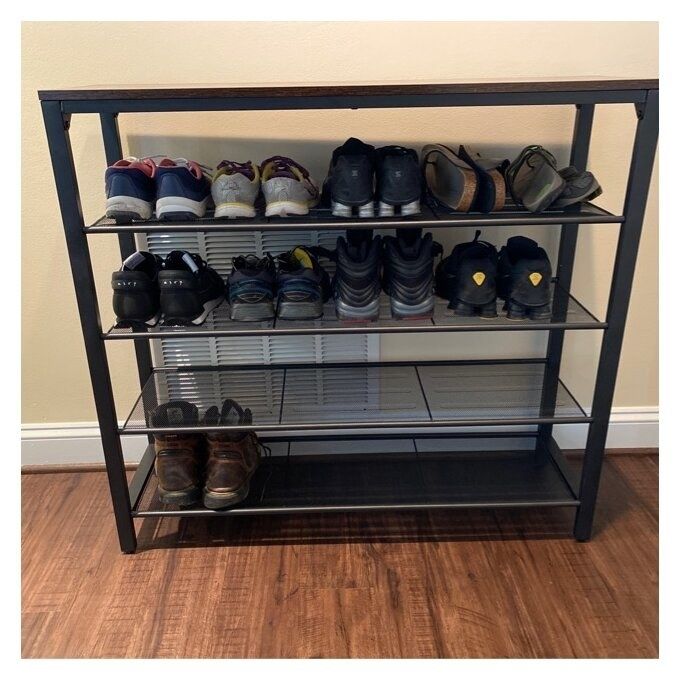 A five-tier shoe rack filled with a variety of footwear, including sneakers, dress shoes, and sandals.