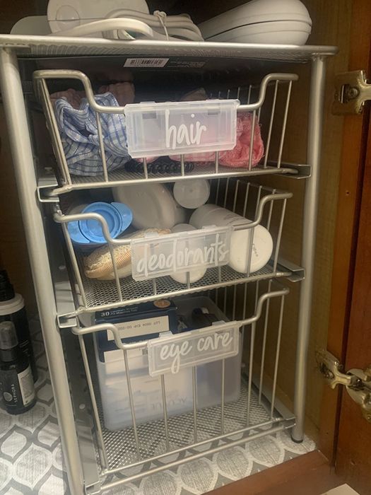 A reviewer's bathroom features labeled shelves using the decals for easy organization.