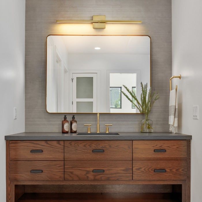 An LED light fixture mounted above the bathroom mirror