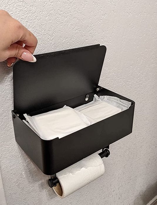 A sleek black wall-mounted toilet paper holder that adds a touch of modern style to your bathroom.