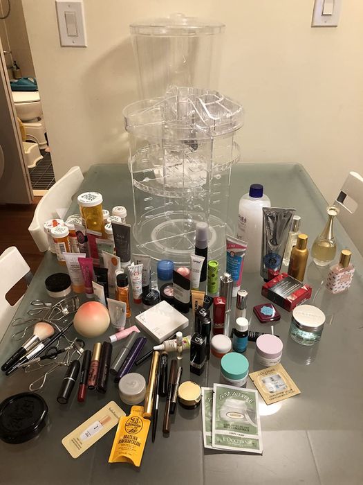 A reviewer’s skincare and makeup arranged neatly on a table.