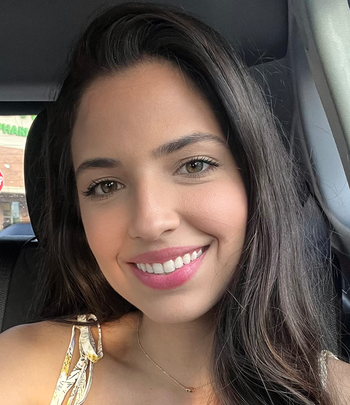 Reviewer with a soft pink lip tint