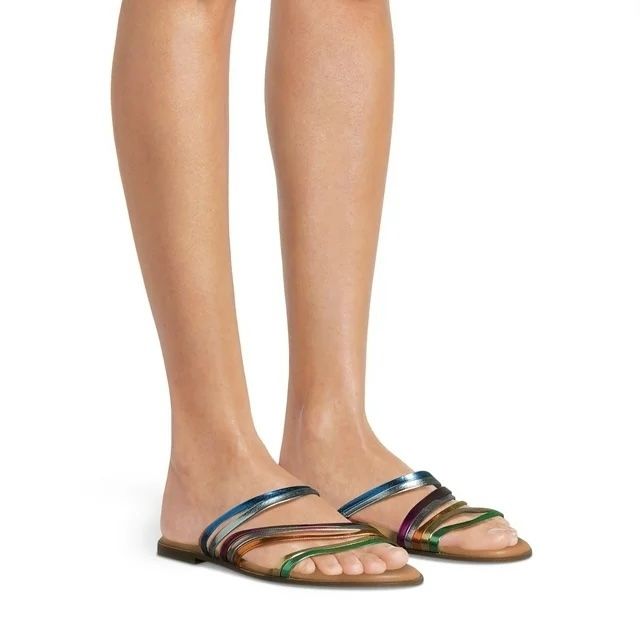 A person sporting multi-strap flat sandals, perfect for casual shopping trips.