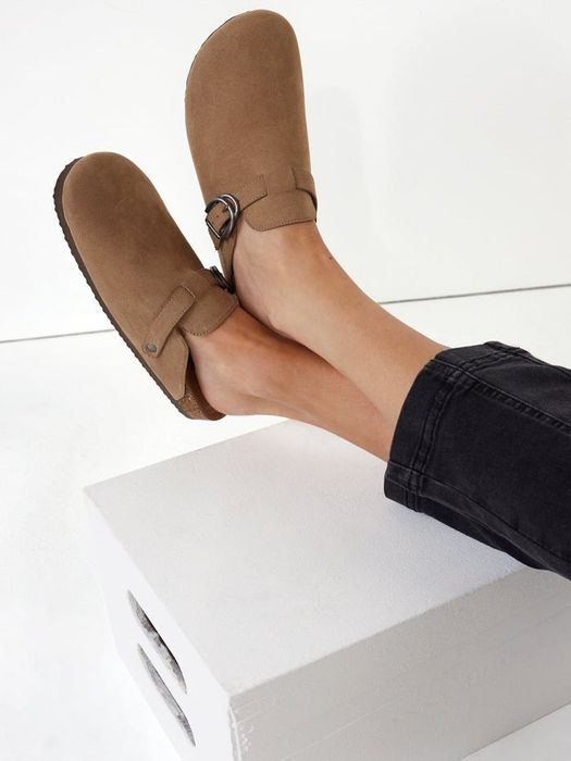 A model showcasing the clogs