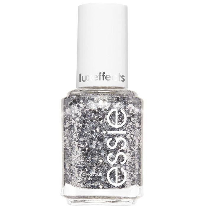 a nail polish bottle filled with silver glitter