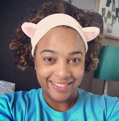 A reviewer modeling the cat ear headband