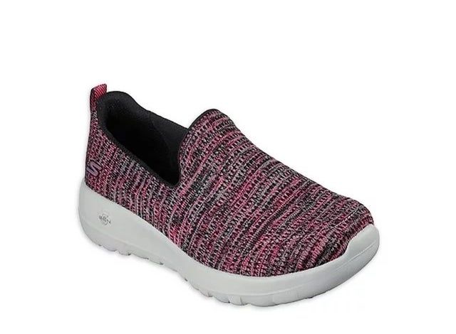 A slip-on sneaker featuring a knitted upper and a crisp white sole, set against a simple background for easy viewing.