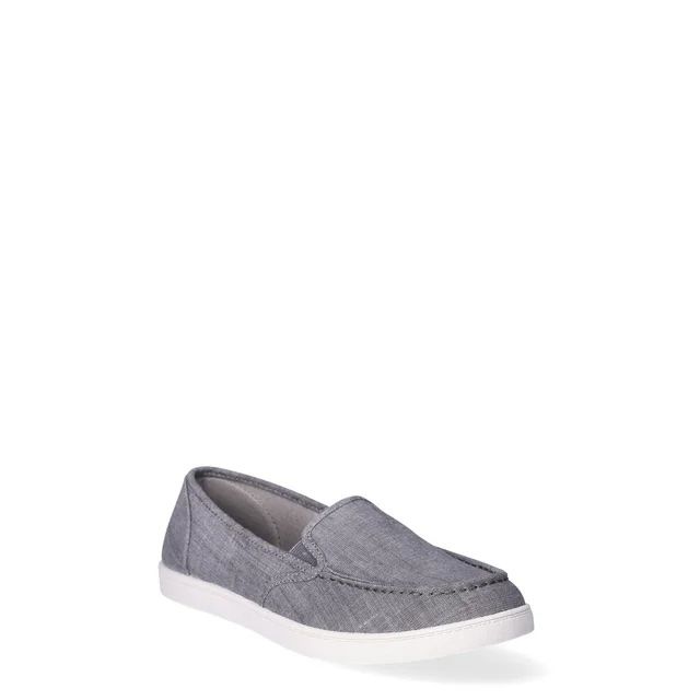 A casual slip-on shoe featuring a canvas upper and white sole, perfect for everyday wear.