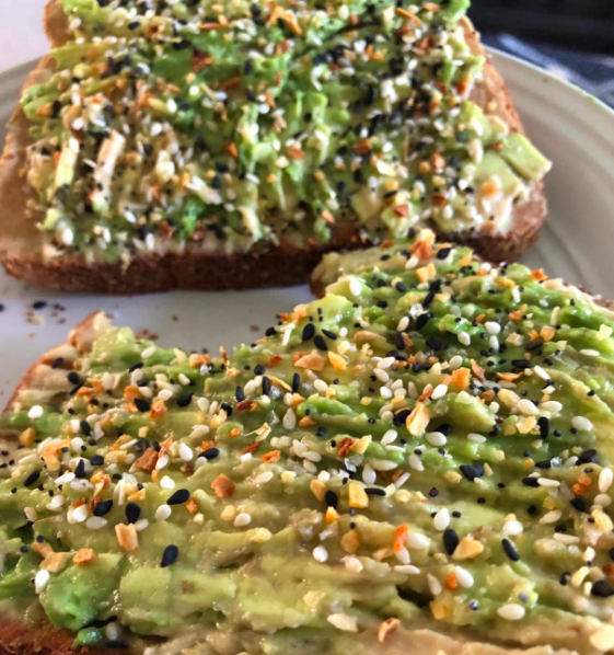A photo from a reviewer showing the seasoning sprinkled generously over a slice of avocado toast