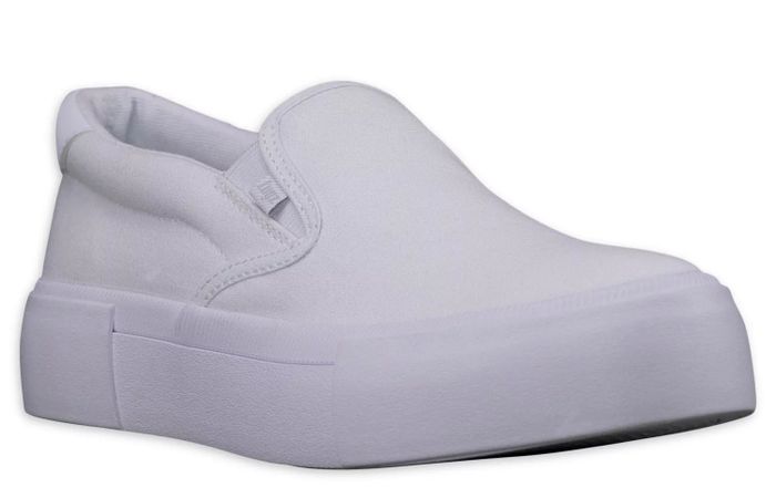 The white slip-on sneakers