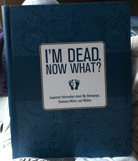 A reviewer’s photo showcasing the cover of the book titled 'I’m Dead, Now What?'