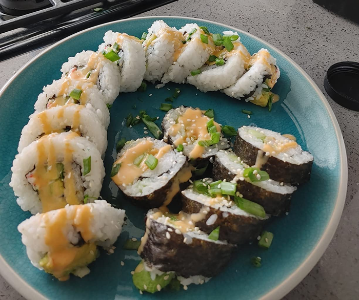 sushi rolls neatly arranged on a plate