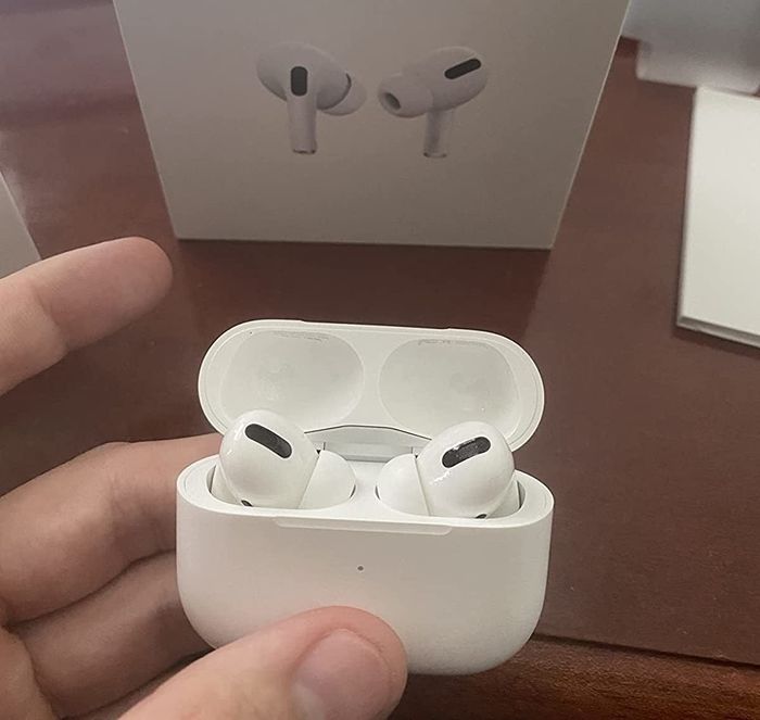 the AirPods neatly stored in their charging case