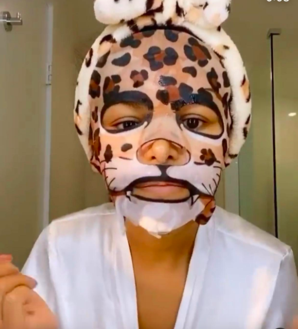 A customer review photo of them wearing the leopard print face mask.