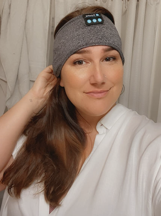 A customer review image of them wearing the sleep headband.