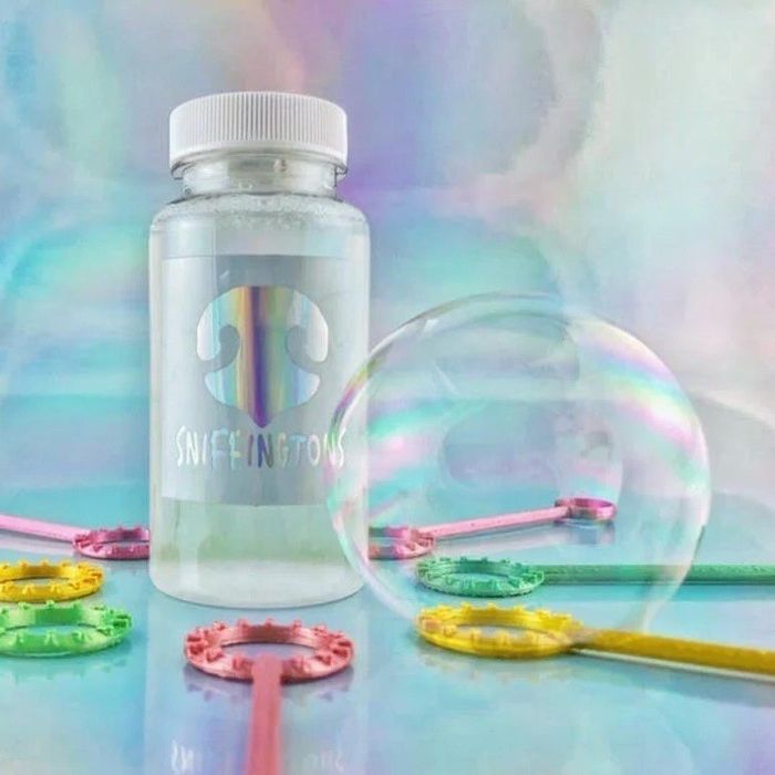 the bottle of bubbles surrounded by sticks