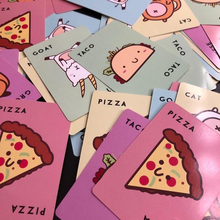 A reviewer's photo showcasing the adorable illustrations on the cards of the game.