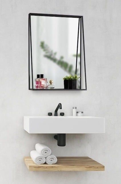 A wall mirror and shelf combo designed to complement your sink area