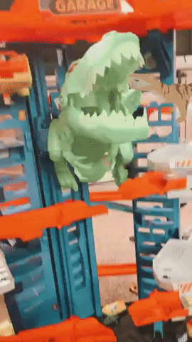 A reviewer's video capturing the thrilling moment when the T-Rex head chomps down on cars as they race along the track.