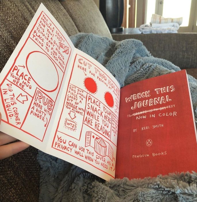 A photo shared by a customer showcasing some of the journal prompts inside the book.