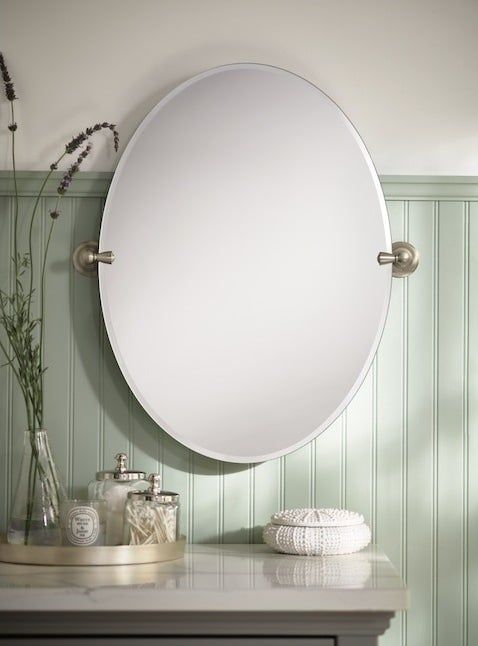 The frameless mirror elegantly mounted on a wall