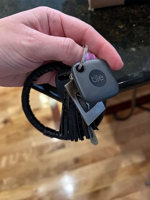 the sleek black square tracker attached to a keychain
