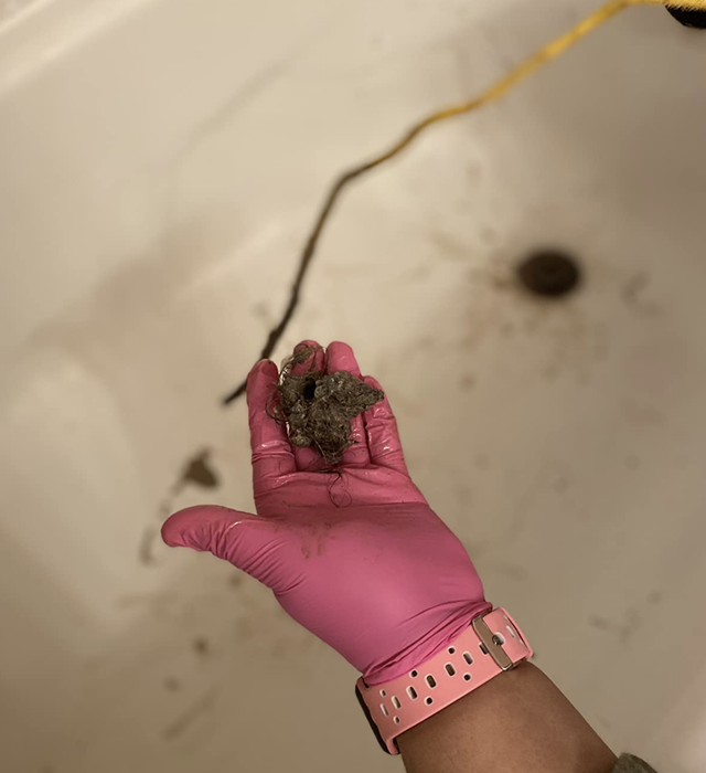 A customer-uploaded image showing the gunk extracted from their drain using the FlexiSnake tool.