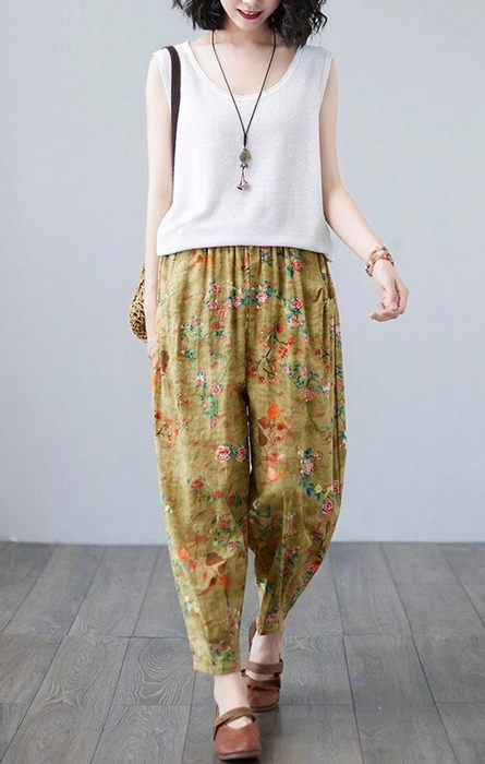 A model wearing the cheerful yellow floral pants.