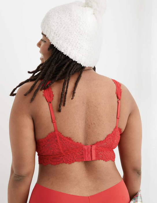 A rear view of a model wearing the lacy bralette in a vibrant red shade.