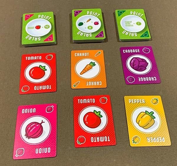 A photo from a reviewer showing the various playing cards laid out.
