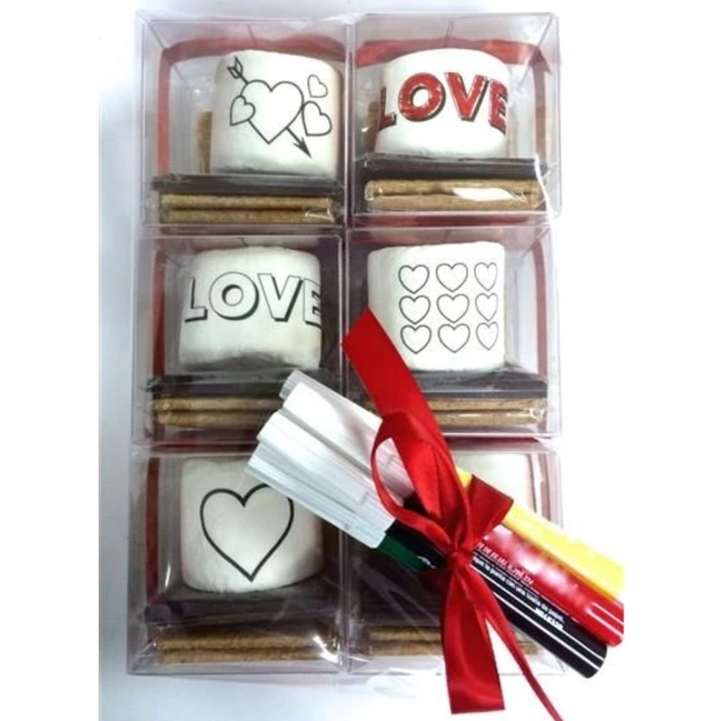A set that includes marshmallows, graham crackers, chocolate, and edible markers