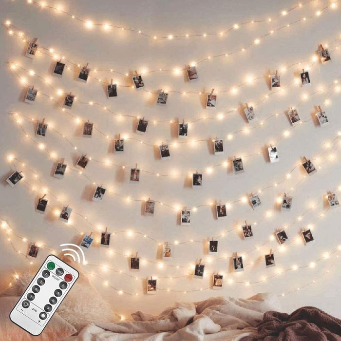 strings of lights adorned with hanging polaroid photos
