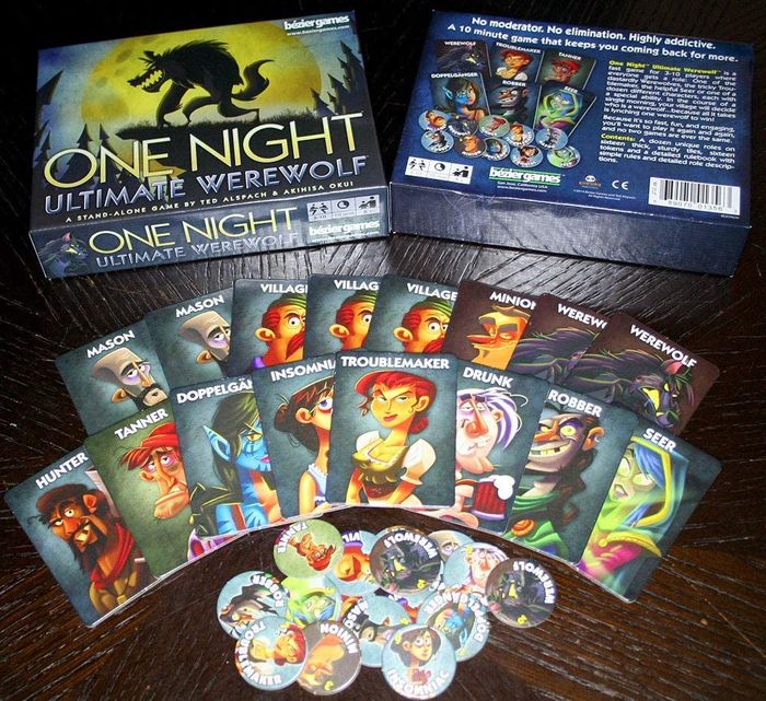 the game box and cards featuring various characters and character tokens 
