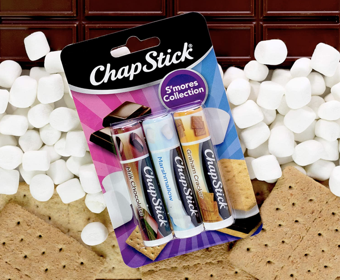 A chapstick case containing flavors like milk chocolate, marshmallow, and graham cracker