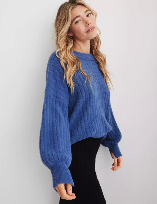 a model sporting a cobalt blue sweater
