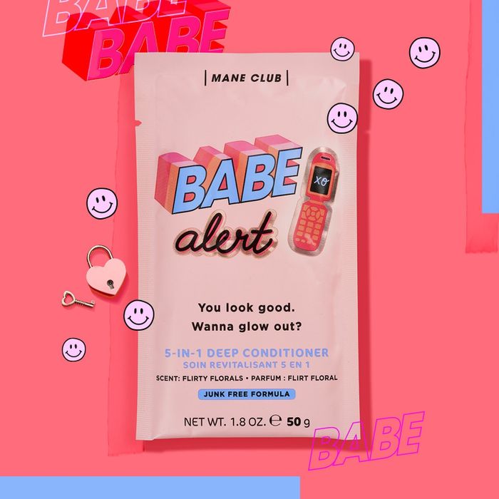 A vibrant pink packet of a 5-in-1 deep conditioner featuring playful text that reads "babe alert."
