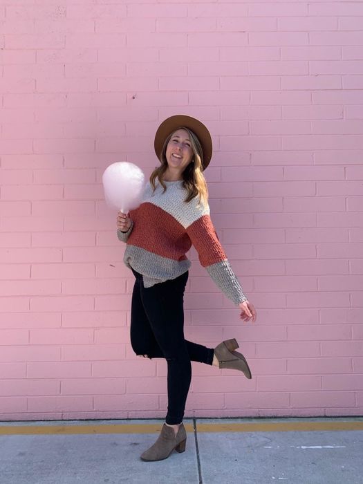 A reviewer in a color-blocked version of the sweater
