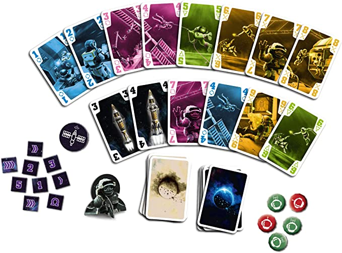 a reviewer's photo showcasing the game cards, dice, and tokens 